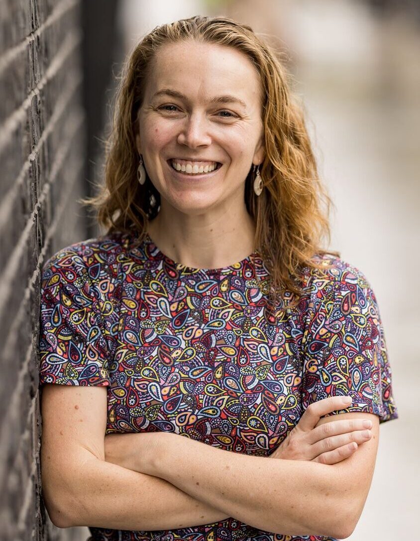 Barrie Moorman is a woman wearing a geometric pattern dress