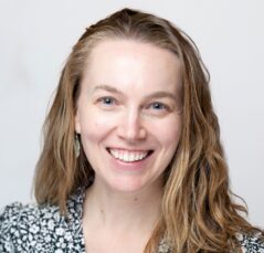 Barrie Moorman is a woman wearing a geometric pattern dress